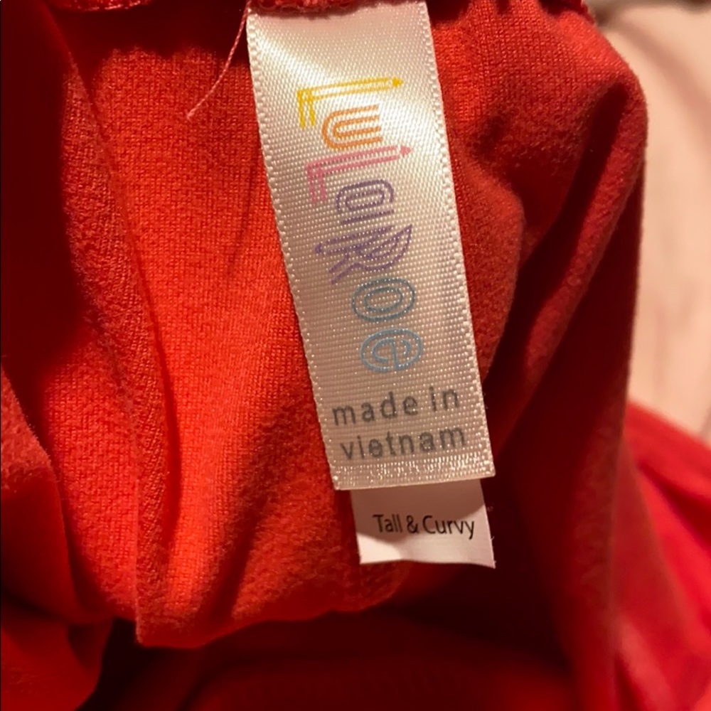Coral lularoe tall and coral leggings.  EUC